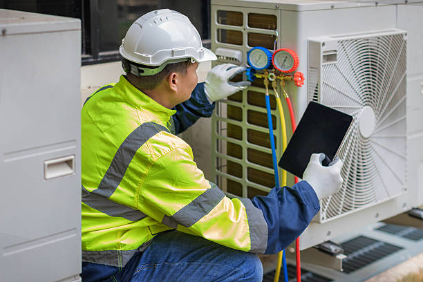 Professional Air Duct Cleaning technician working in Clinton, OK